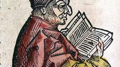 Image of Bede reading a book